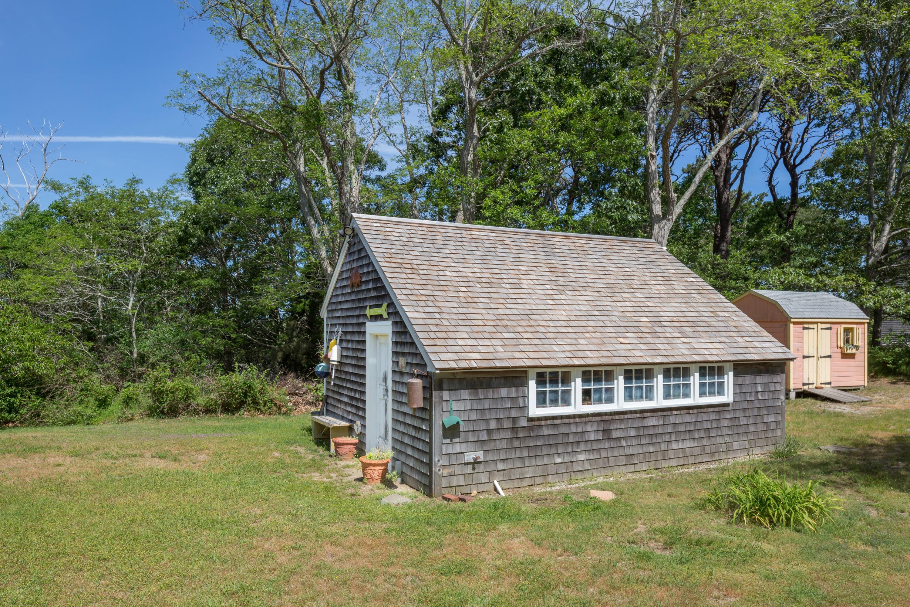 5 Depot Road Truro, MA 02666 - Photo 20 of 21 a aerial view of a house next to a big yard and large trees