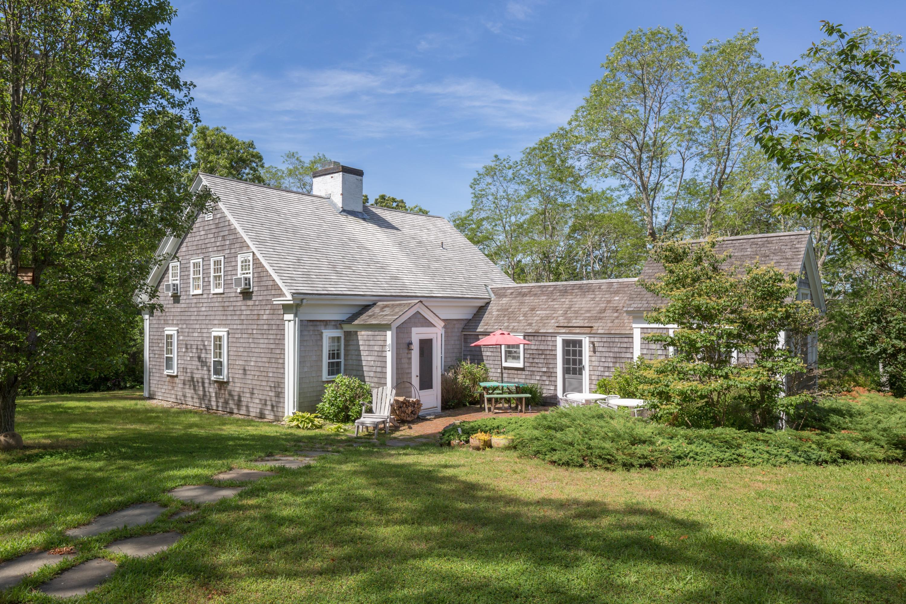 5 Depot Road Truro, MA 02666 - Photo 2 of 21 a front view of a house with a garden