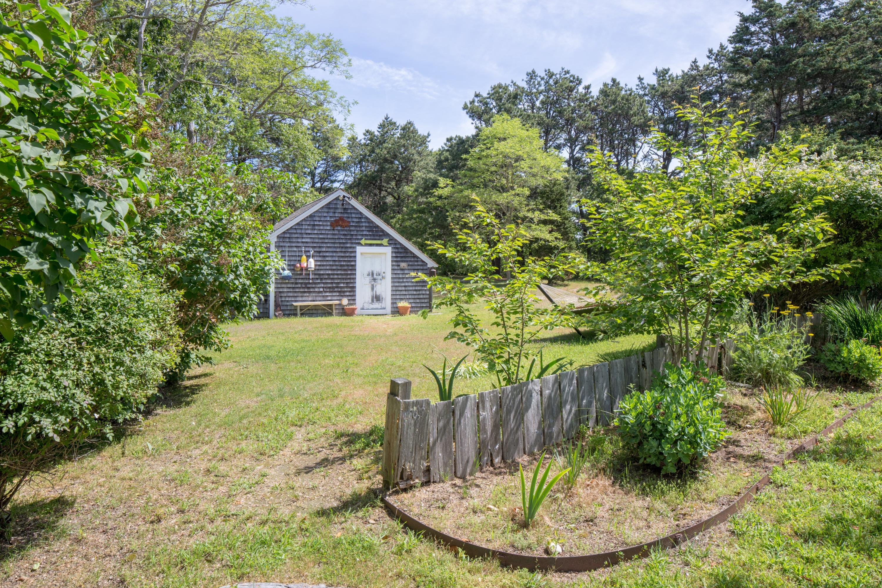 5 Depot Road Truro, MA 02666 - Photo 21 of 21 a view of a house with a backyard