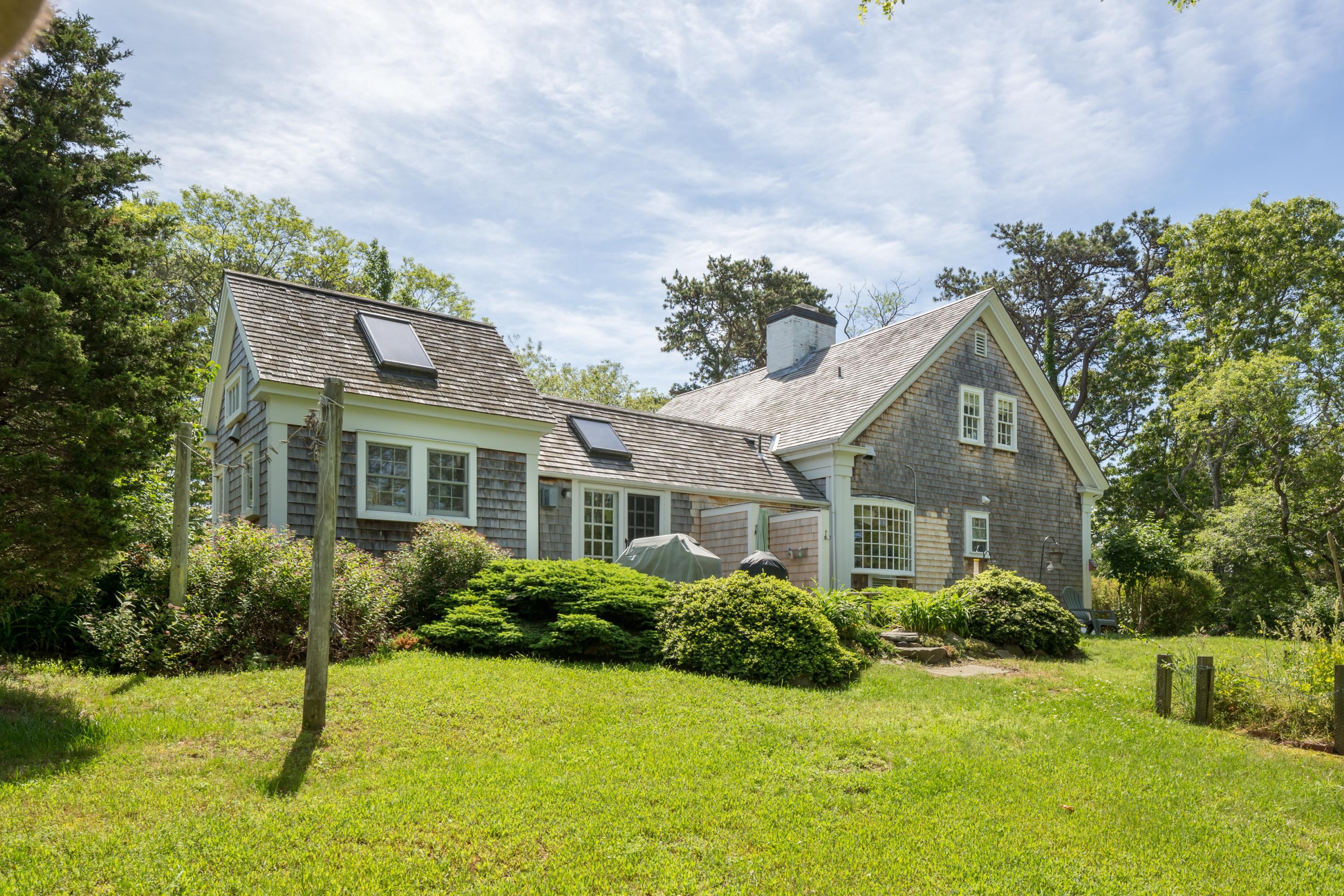 5 Depot Road Truro, MA 02666 - Photo 4 of 21 a front view of a house with a yard