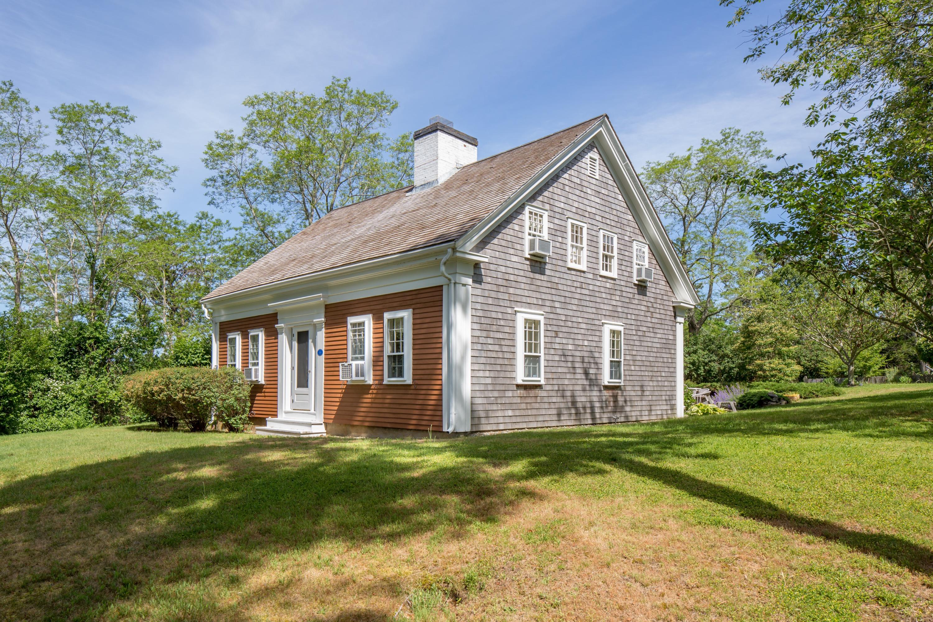 5 Depot Road Truro, MA 02666 - Photo 8 of 21 a view of a house with a yard and potted plants