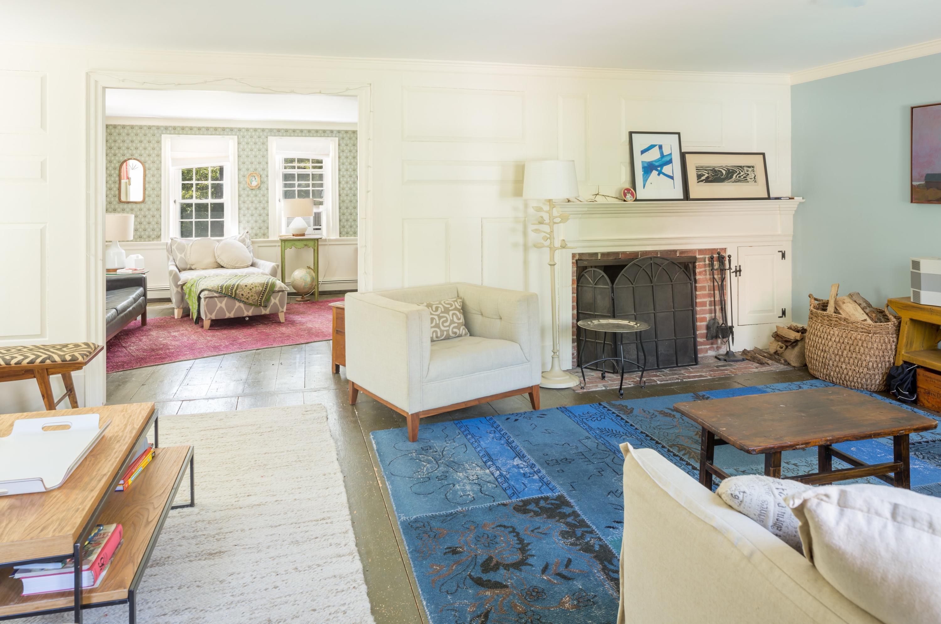 5 Depot Road Truro, MA 02666 - Photo 10 of 21 a living room with furniture and a fireplace