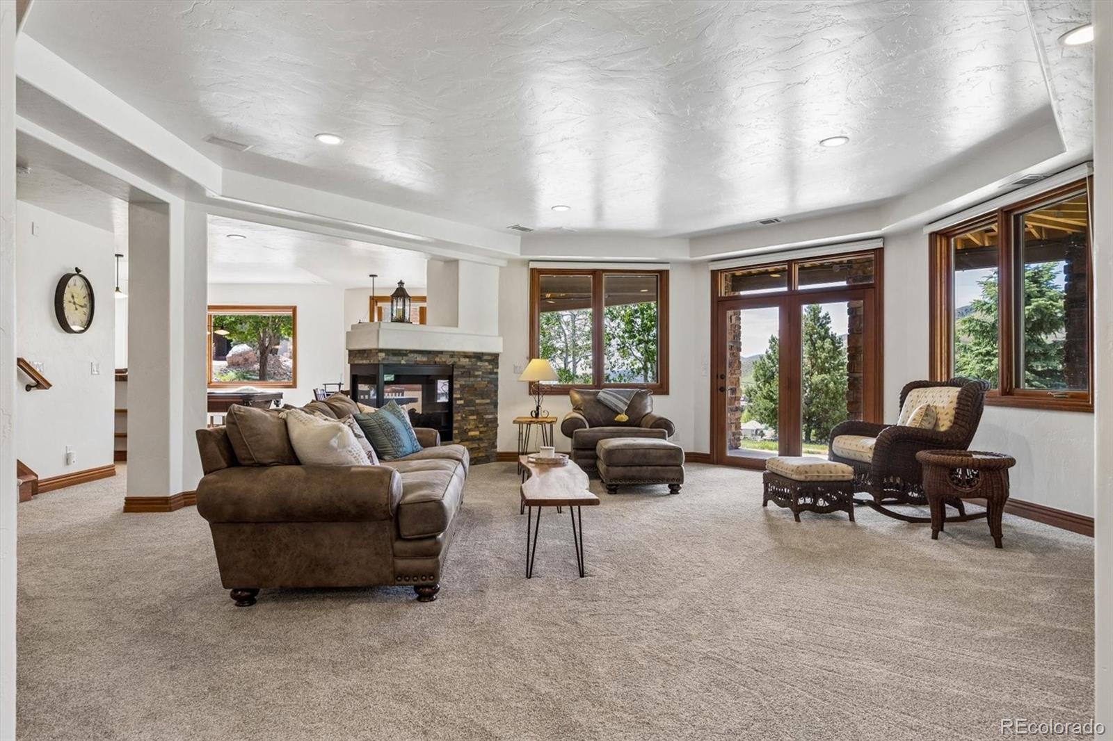 16422 Rocky Point Lane Morrison, CO 80465 - Photo 29 of 50 a living room with furniture and a large window
