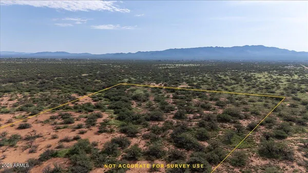 an aerial view of residential house and green space