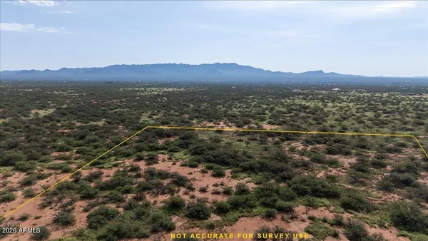 an aerial view of residential house and green space