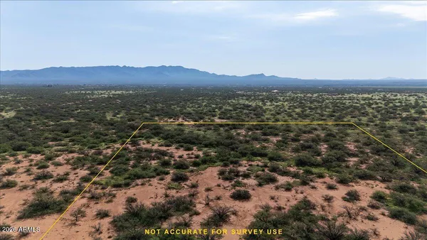 an aerial view of residential house and green space