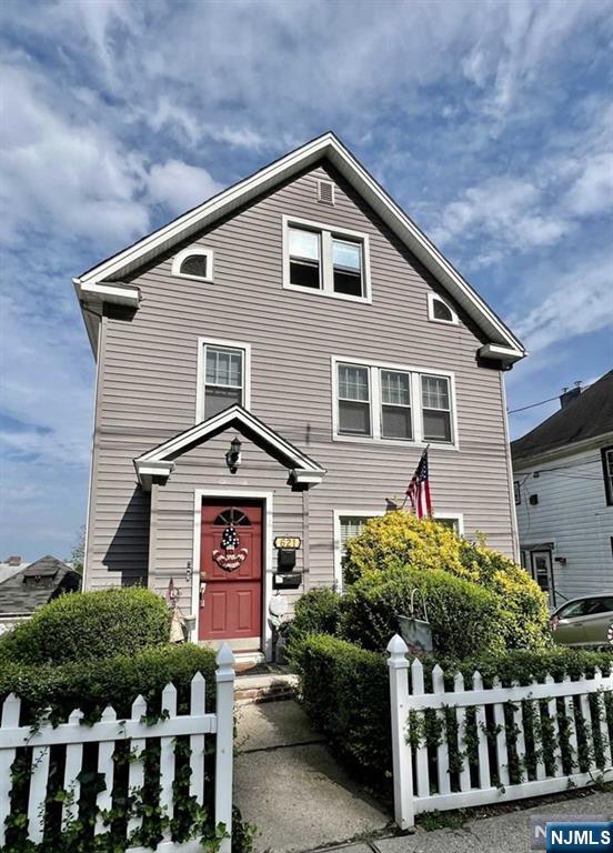 621 Undercliff Avenue, Unit 2 Edgewater, NJ 07020 - Photo 14 of 14 a front view of a house with a garden