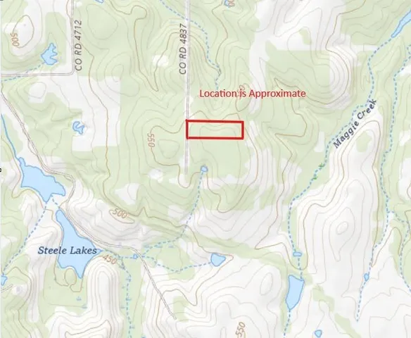 a white bed sitting next to a white wall