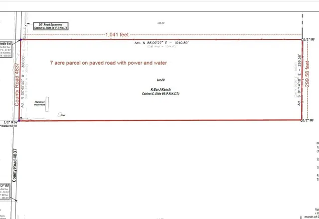 a picture of a room with a white wall and a refrigerator