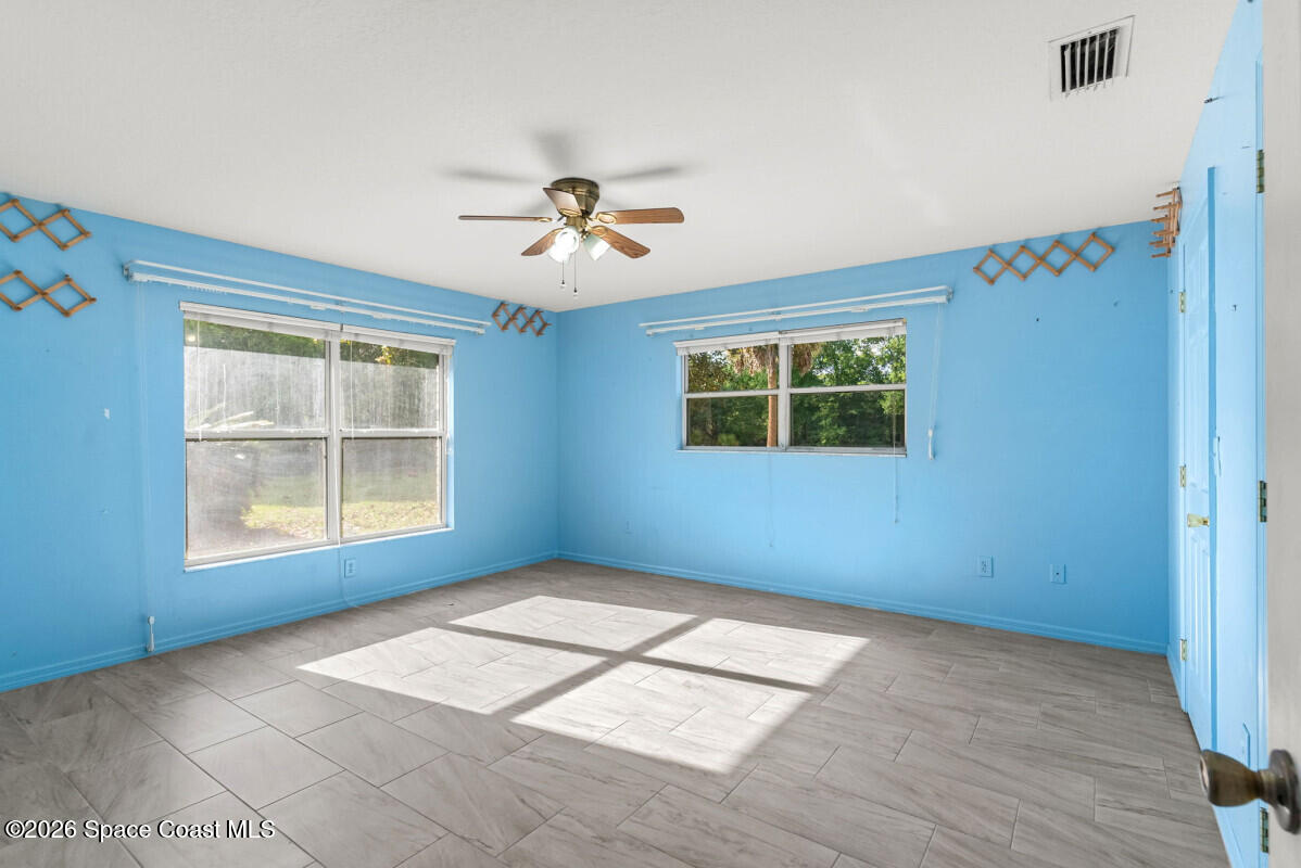 2493 Adamson Road Cocoa, FL 32926 - Photo 25 of 46 a view of an empty room with a window