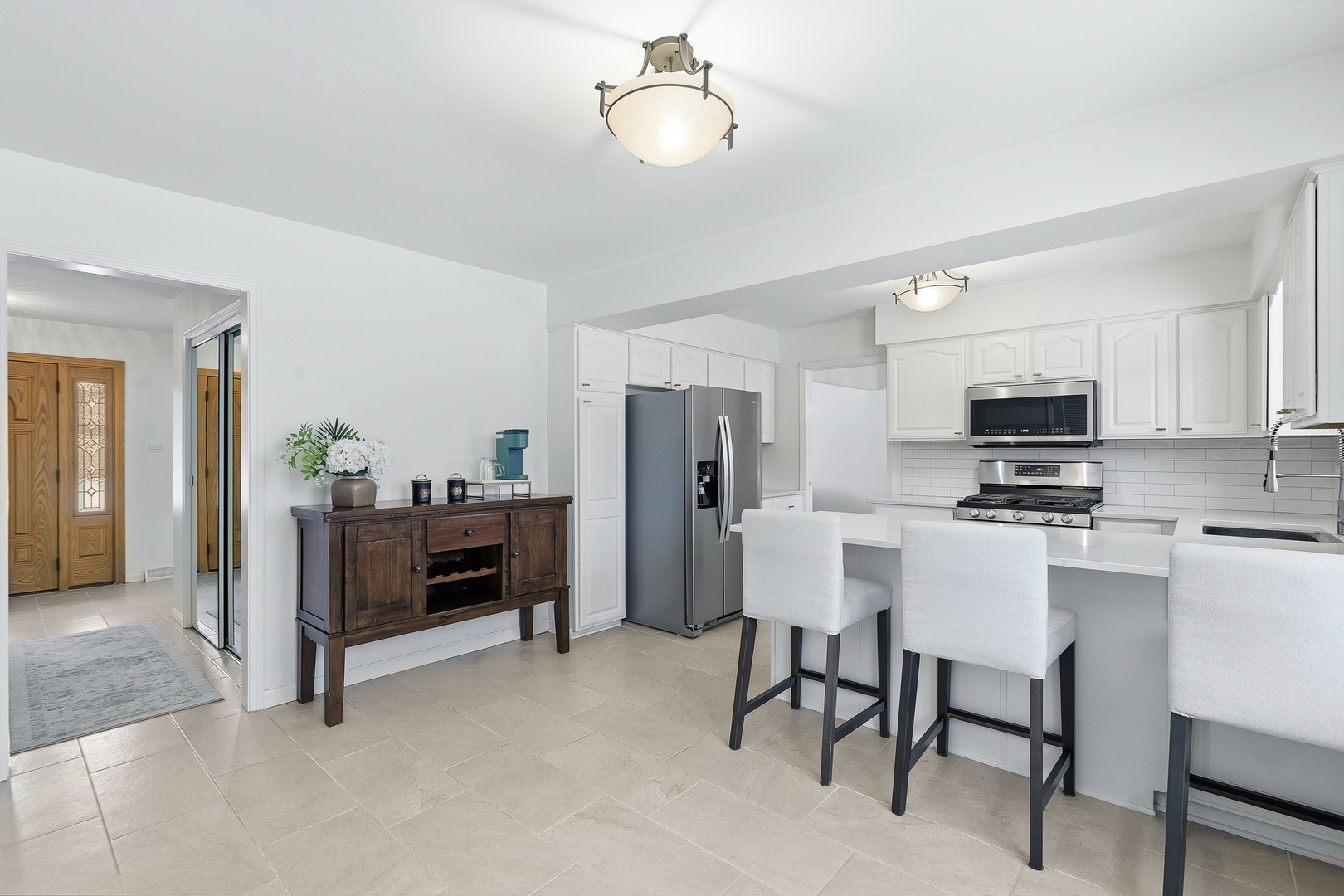 7209 Grant Street Darien, IL 60561 - Photo 14 of 37 a view of kitchen with furniture and refrigerator