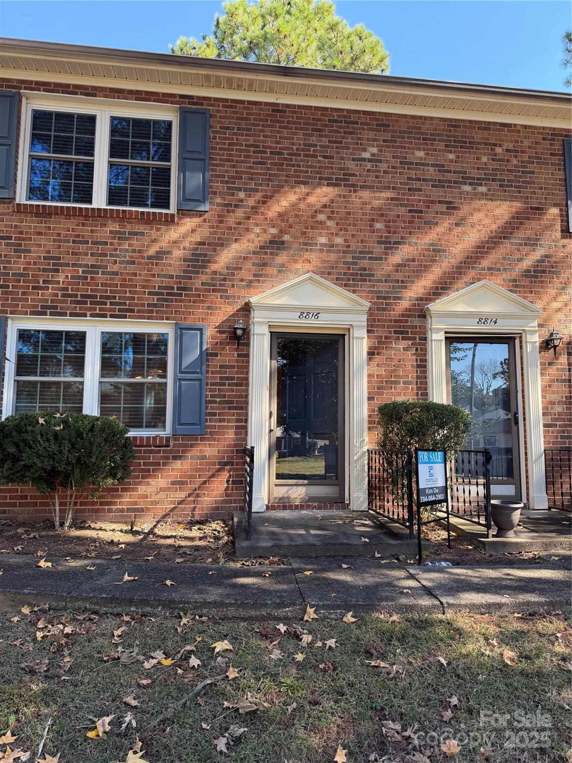 a front view of a house with yard