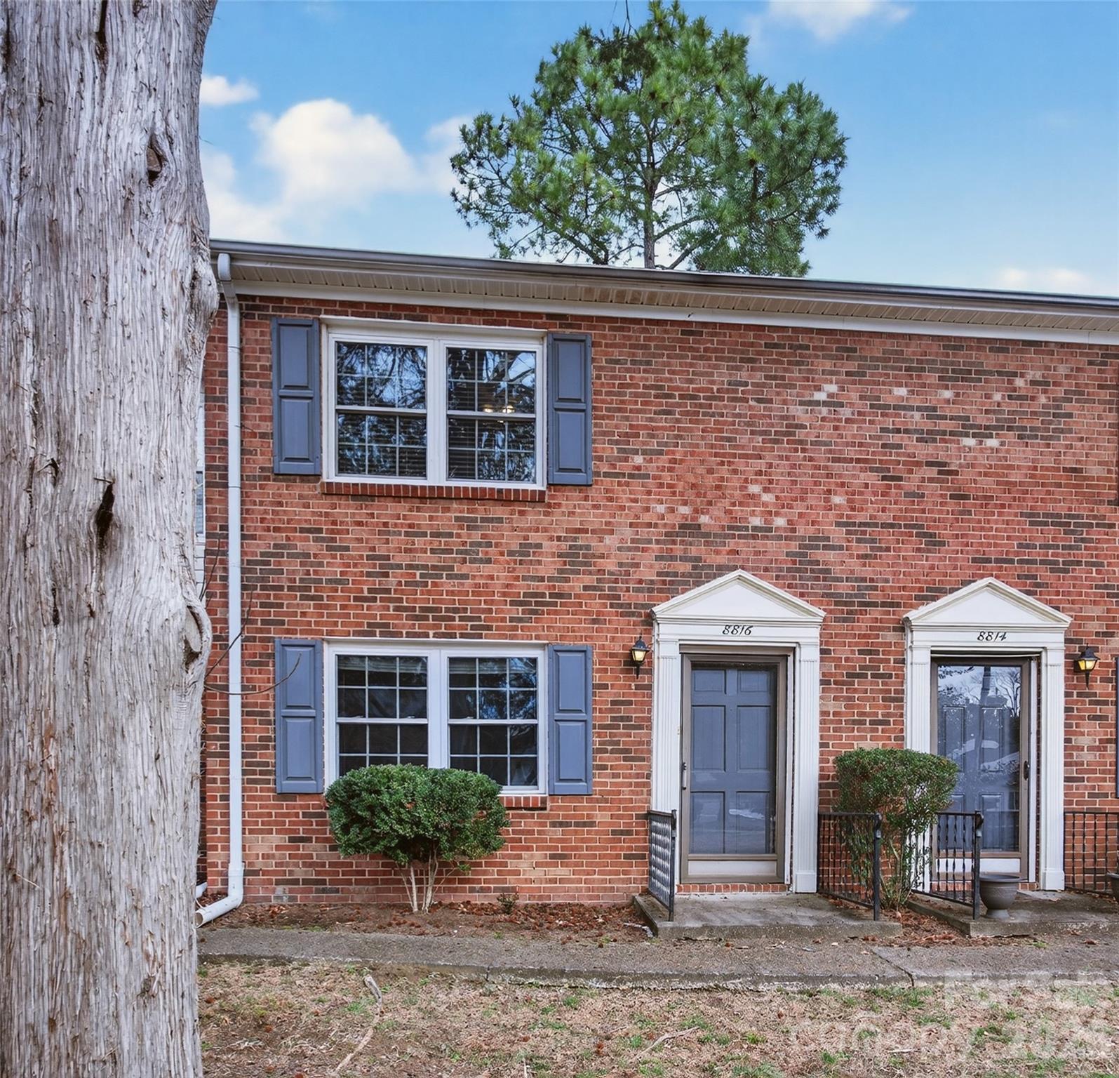 8816 Hunter Ridge Drive Charlotte, NC 28226 - Photo 1 of 14 a front view of a house with garden