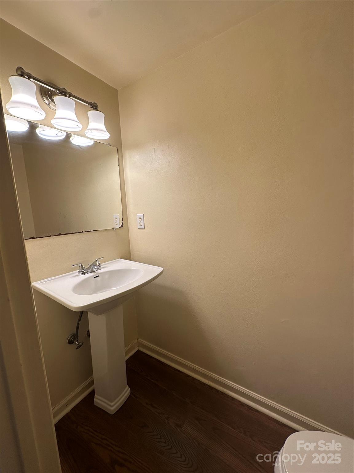 8816 Hunter Ridge Drive Charlotte, NC 28226 - Photo 4 of 14 a room with a sink and a mirror