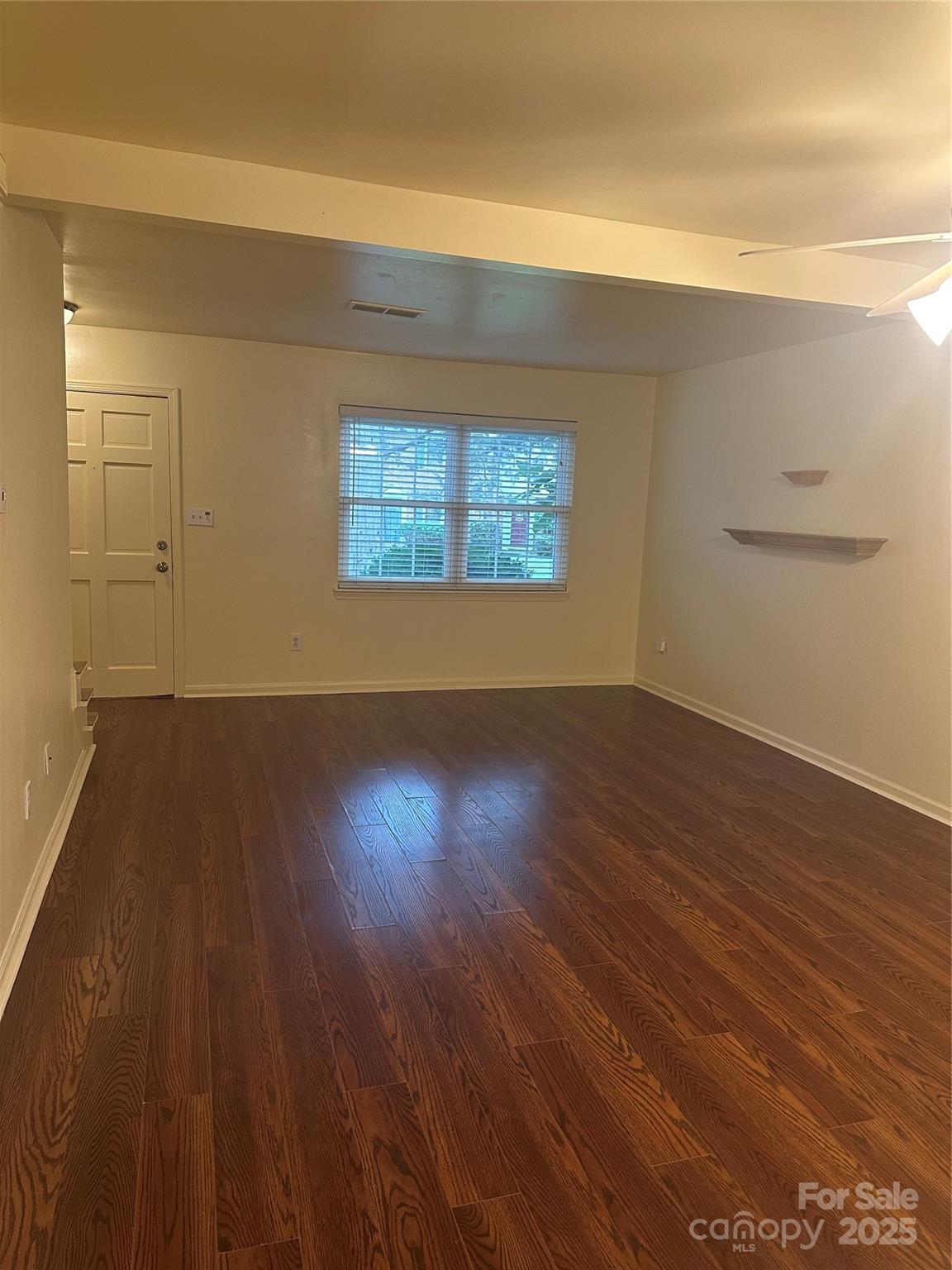 8816 Hunter Ridge Drive Charlotte, NC 28226 - Photo 5 of 14 a view of a room with wooden floor and a window