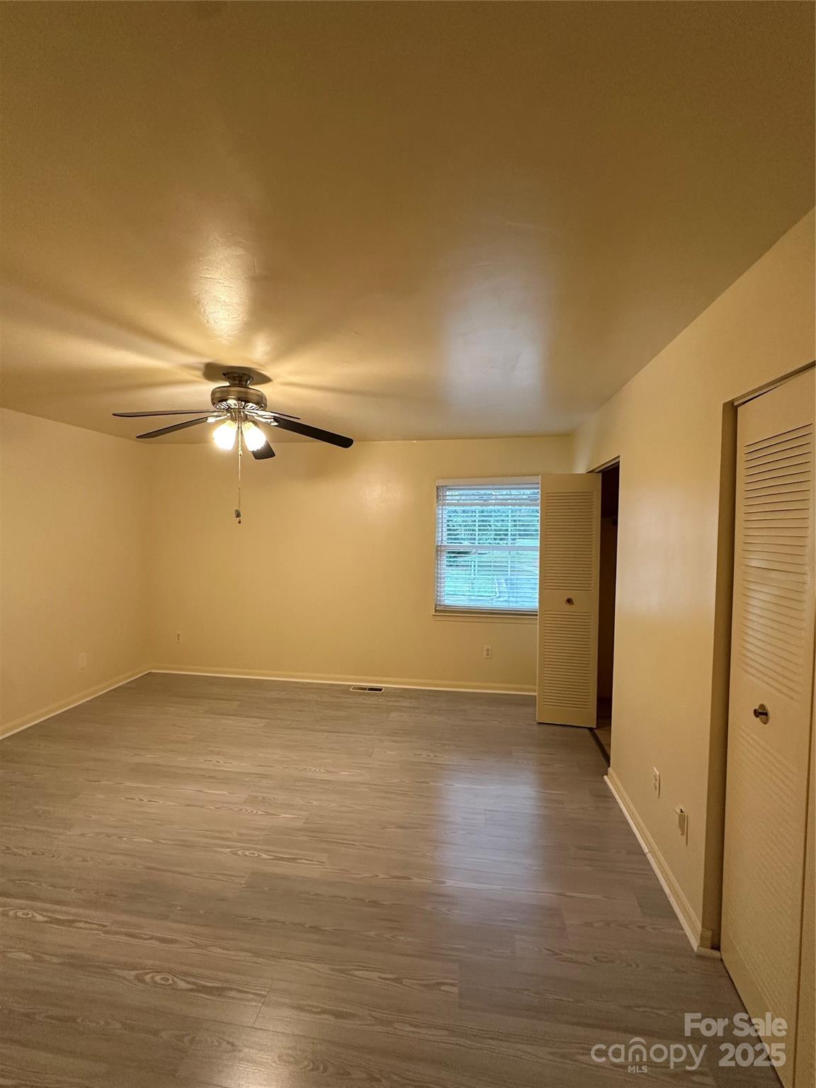 8816 Hunter Ridge Drive Charlotte, NC 28226 - Photo 8 of 14 a view of empty room with wooden floor