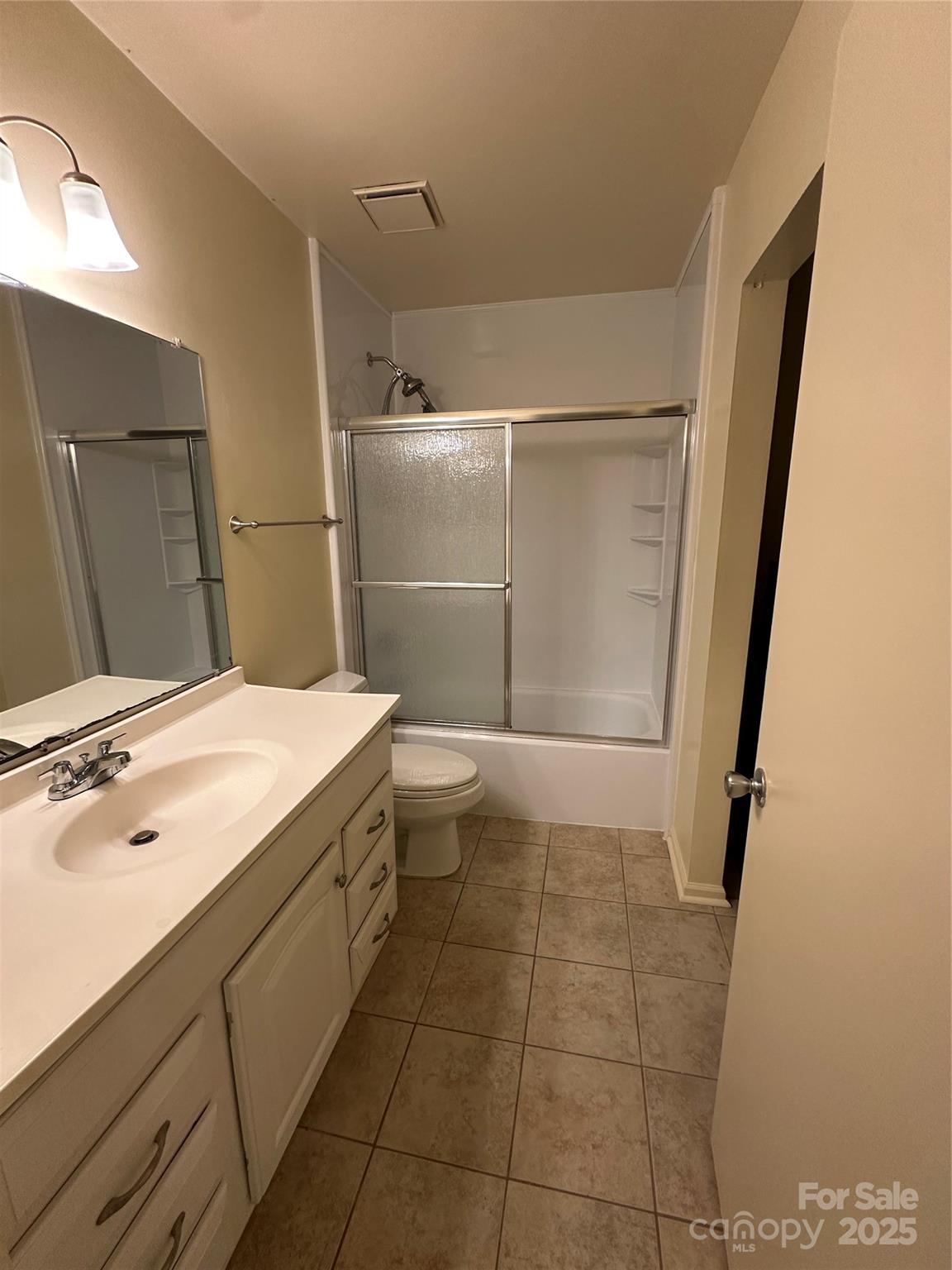 8816 Hunter Ridge Drive Charlotte, NC 28226 - Photo 9 of 14 a bathroom with a sink a toilet and shower