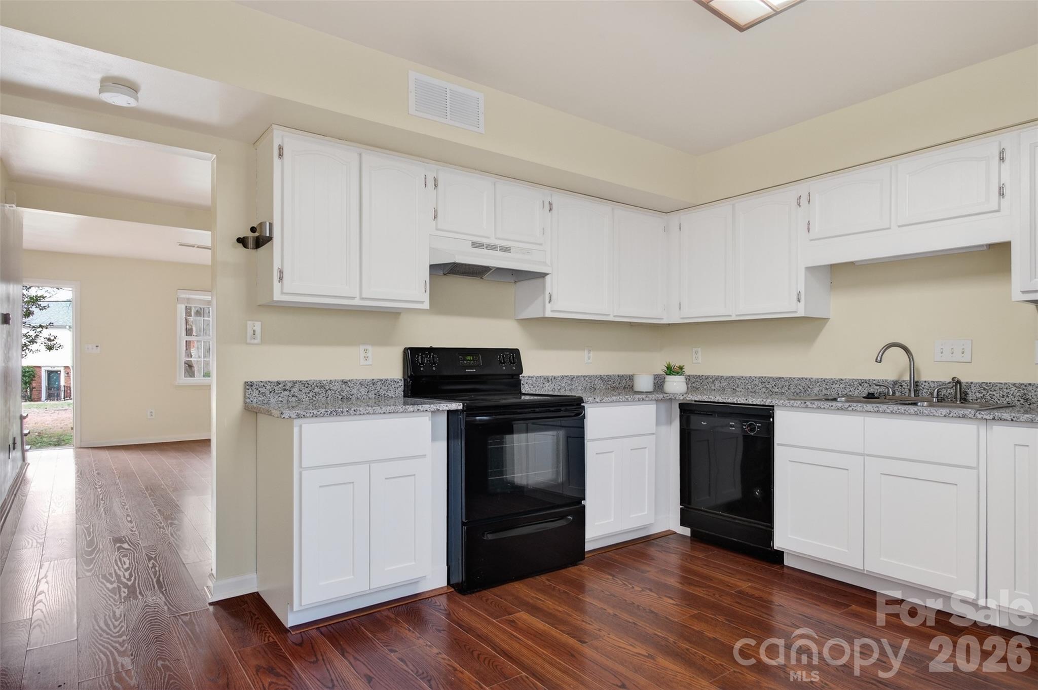 8816 Hunter Ridge Drive Charlotte, NC 28226 - Photo 10 of 14 a kitchen with a sink stove and cabinets