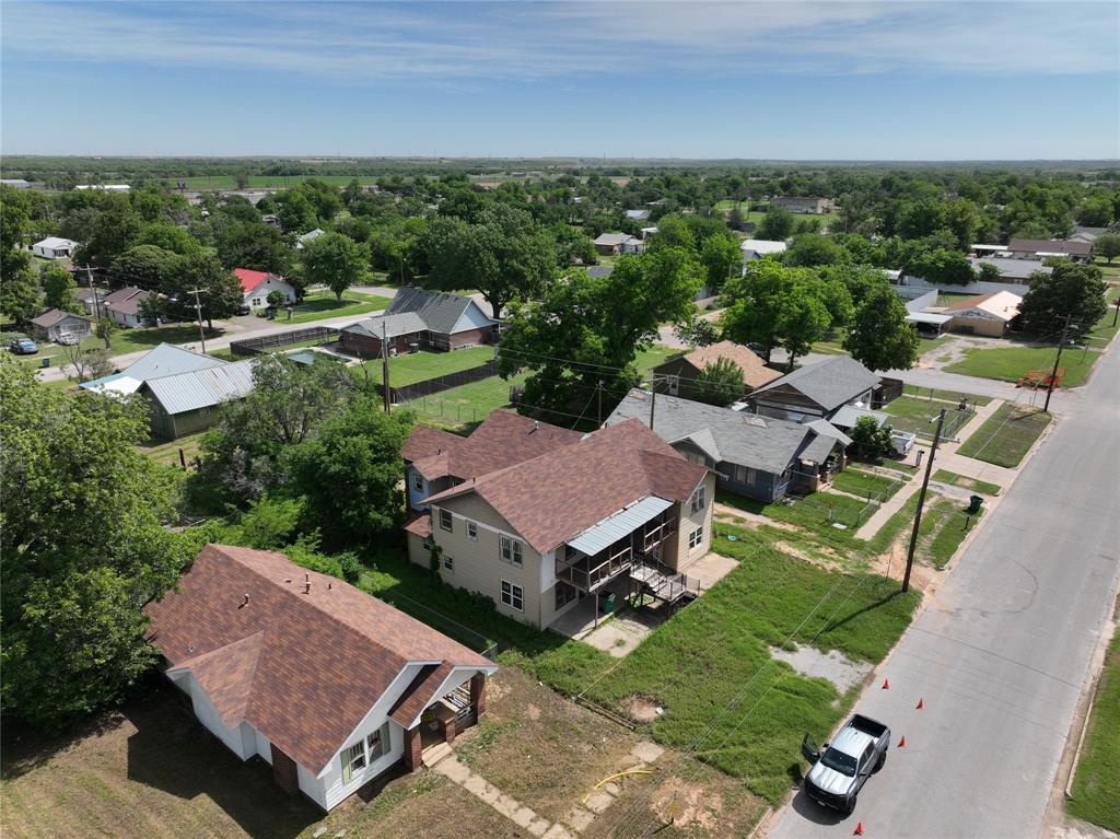 1428 Texas Street Vernon, TX 76384 - Photo 6 of 30 an aerial view of a house with garden space and street view