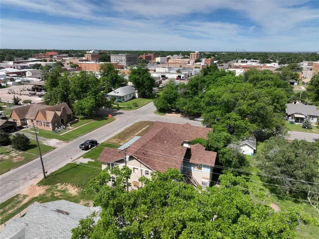 an aerial view of a house with a garden