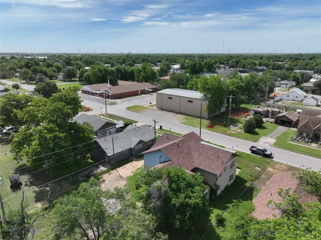 an aerial view of a house with a garden