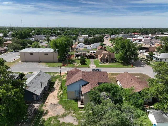 an aerial view of a house with a garden