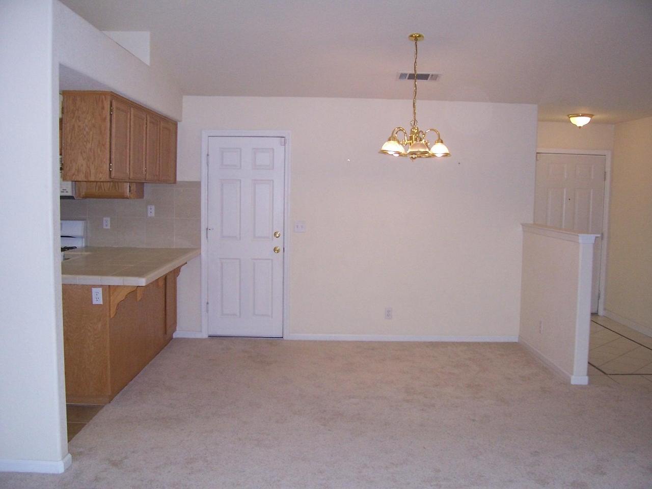 3351 Lawrence Road Redding, CA 96002 - Photo 4 of 8 a kitchen that has a lot of white cabinets and stainless steel appliances