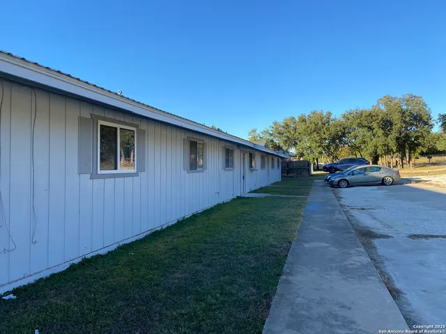 a view of a back yard of the house