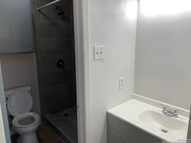 a bathroom with a toilet and a sink