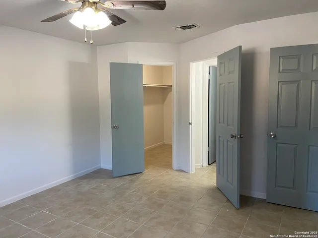 a view of an empty room with a bathroom