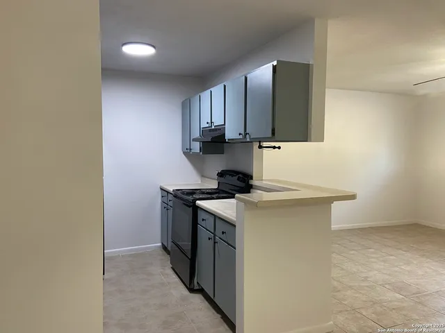 a kitchen with stainless steel appliances granite countertop a stove and a sink