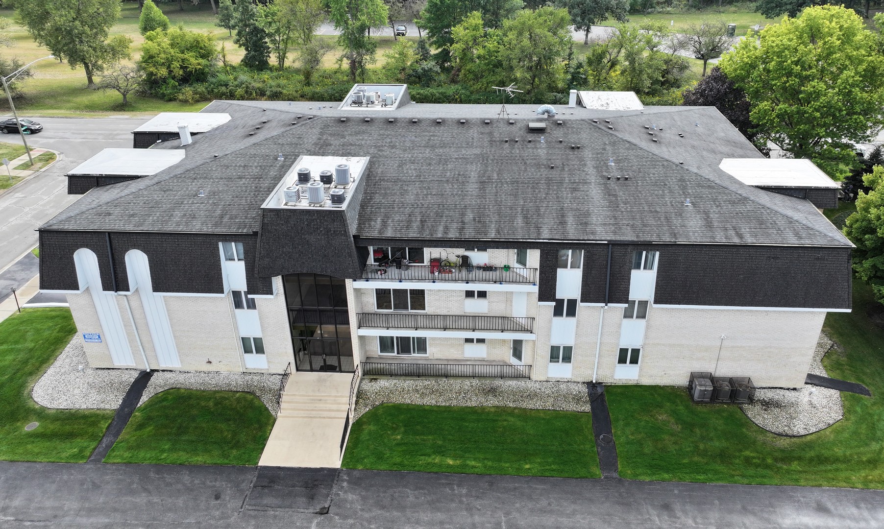 an aerial view of multiple house with a yard
