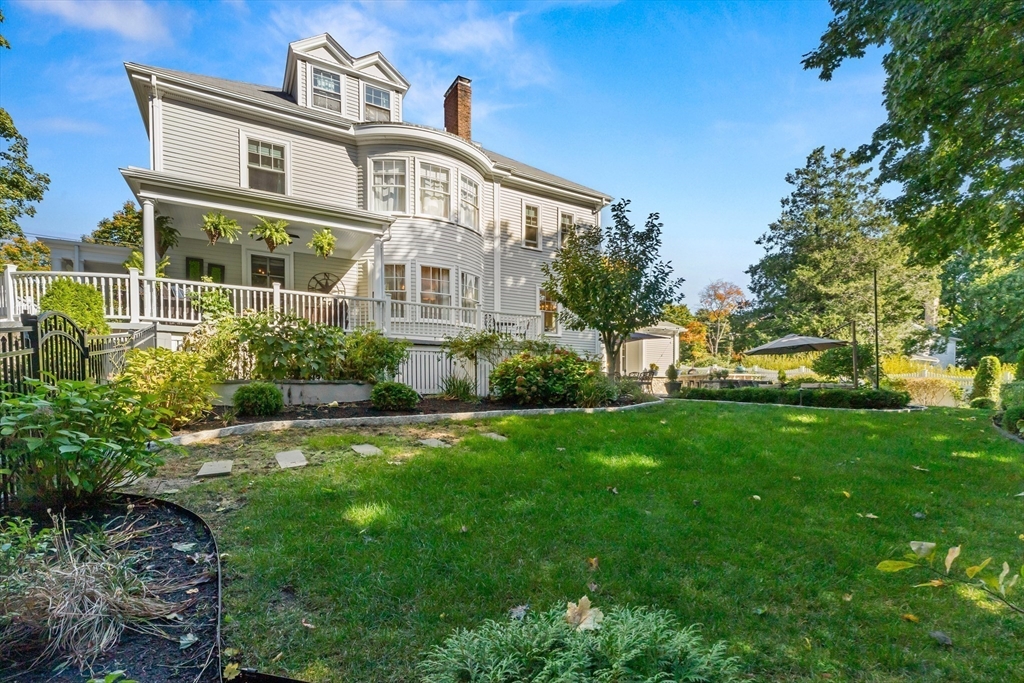 9 Winthrop Street Danvers, MA 01923 - Photo 40 of 41 a front view of a house with a yard