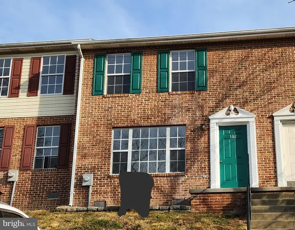 a front view of a house with large windows