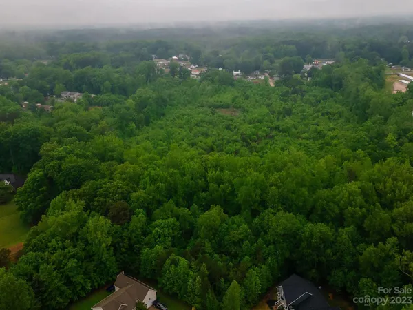 an aerial view of houses with yard