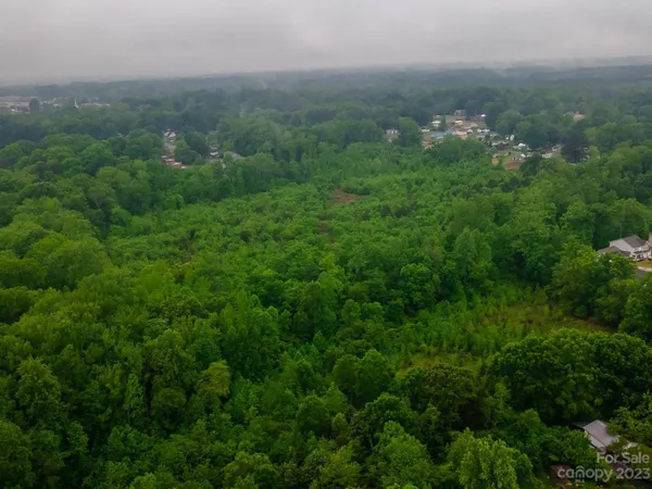 an aerial view of a city with lots of green space