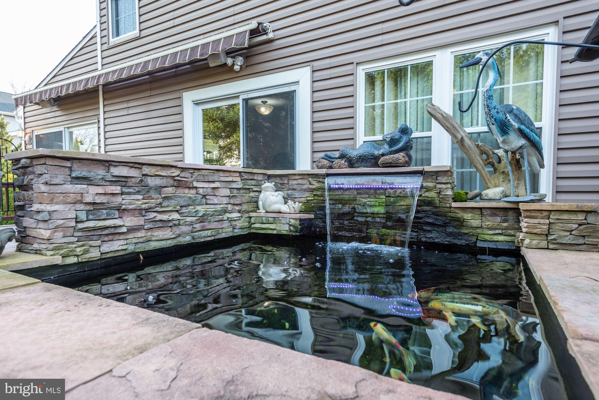 6689 Hunter Road Elkridge, MD 21075 - Photo 32 of 43 Koi Pond with Waterfall