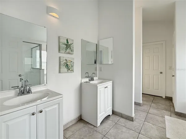a spacious bathroom with a sink a mirror and a vanity