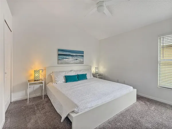 a bedroom with a bed and a table in it