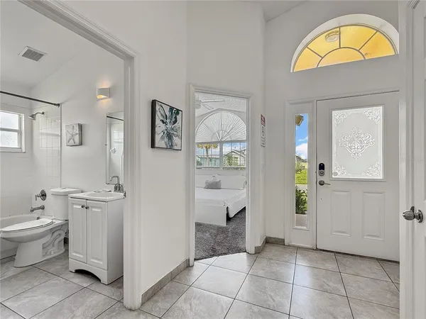 a view of bathroom with dual sinks and a shower