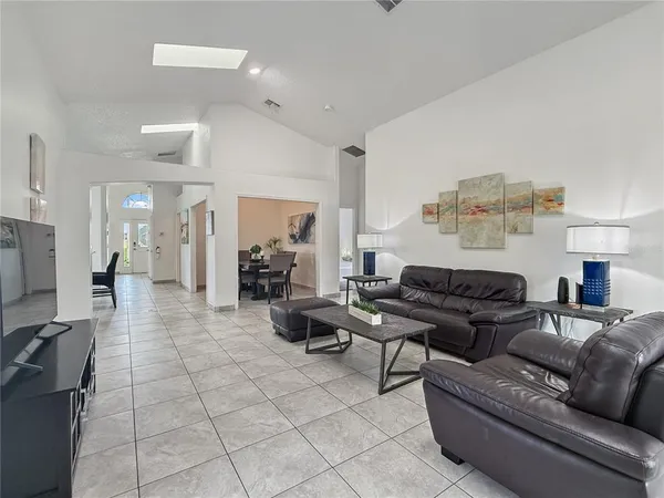 a living room with furniture and a flat screen tv