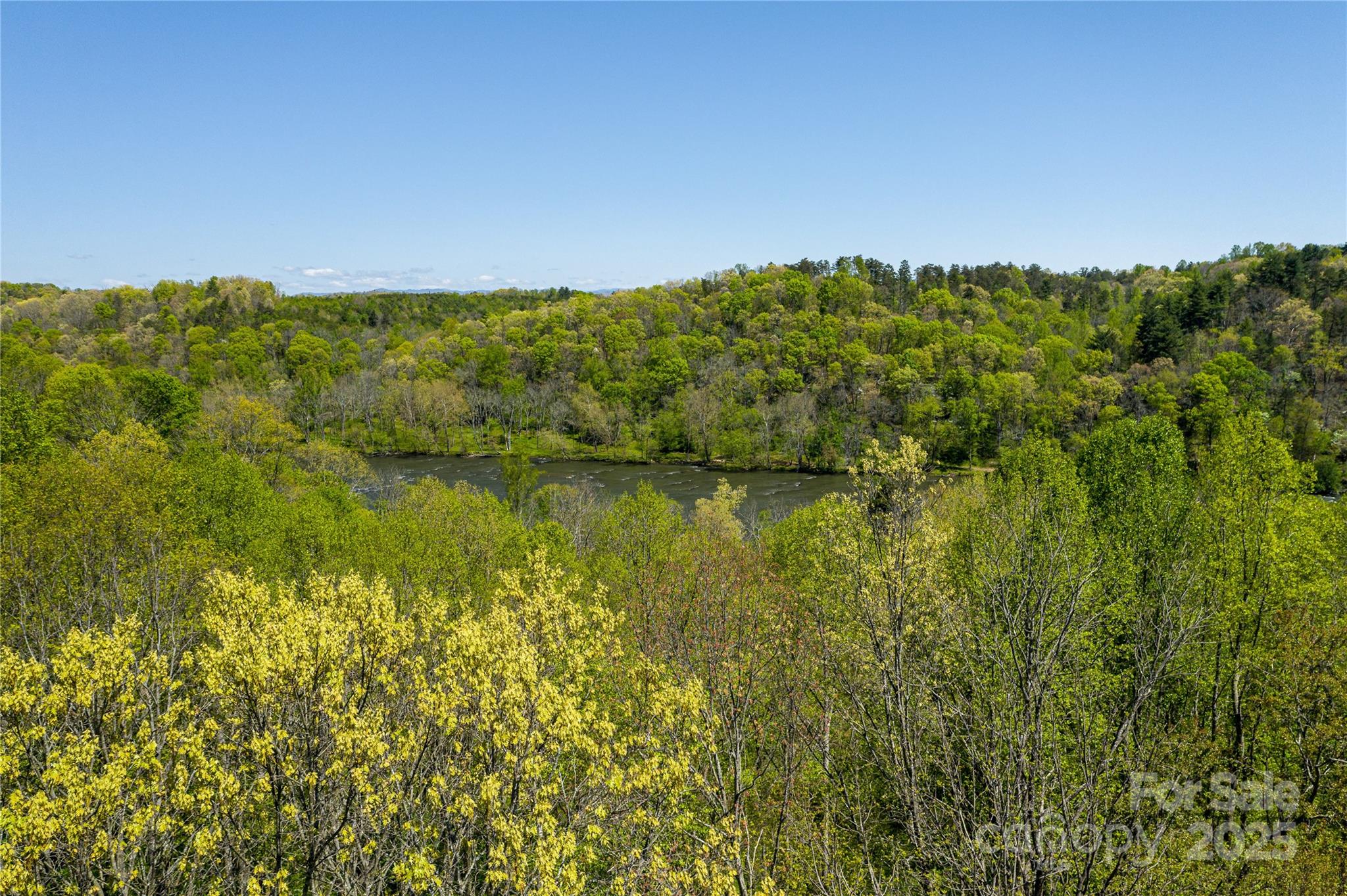 150 Old Macedonia Road Asheville, NC 28804 - Photo 22 of 24 a view of a lake with a city