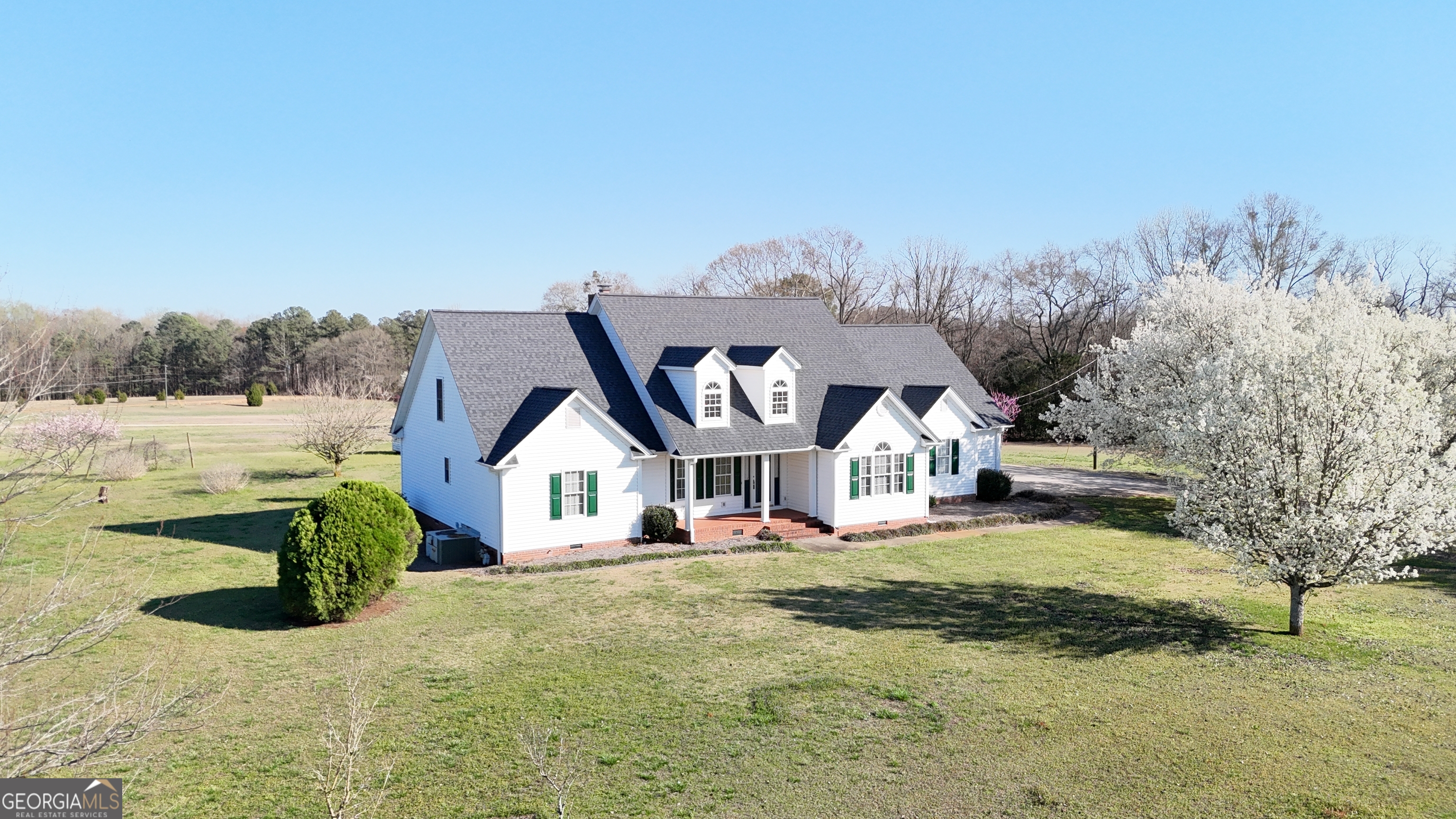 494 Broad Street Bowman, GA 30624 - Photo 58 of 65 a front view of a house with a yard