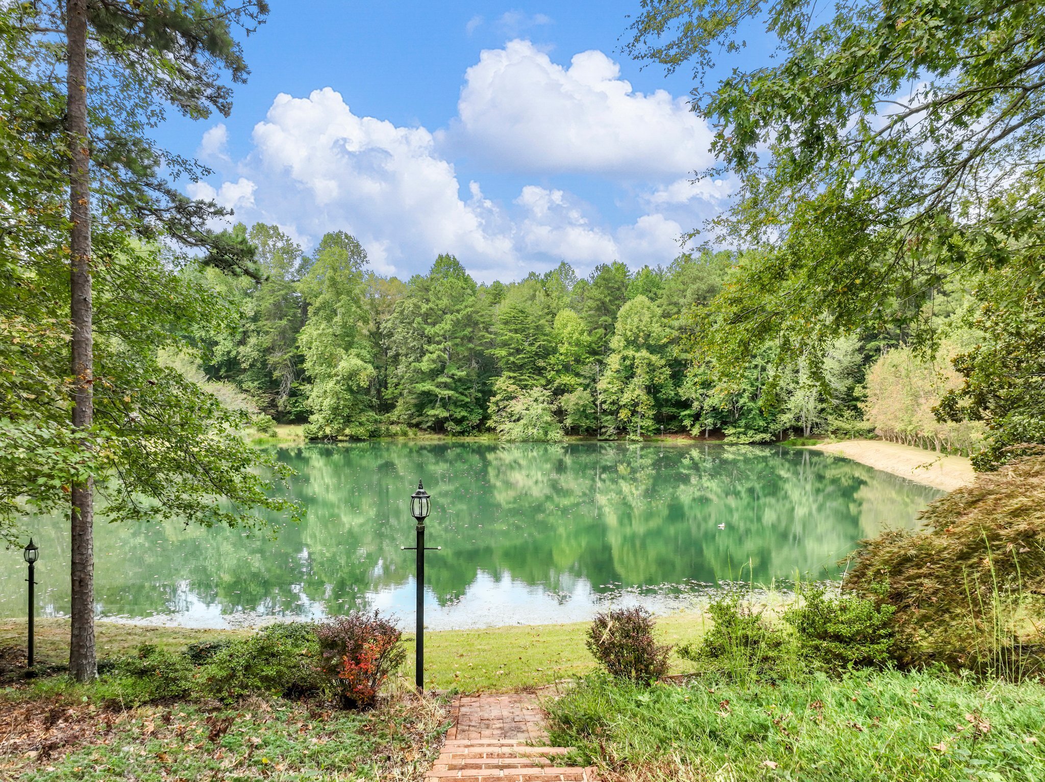 4394 Holly Springs Road Pendergrass, GA 30567 - Photo 48 of 80 a view of a lake from a yard