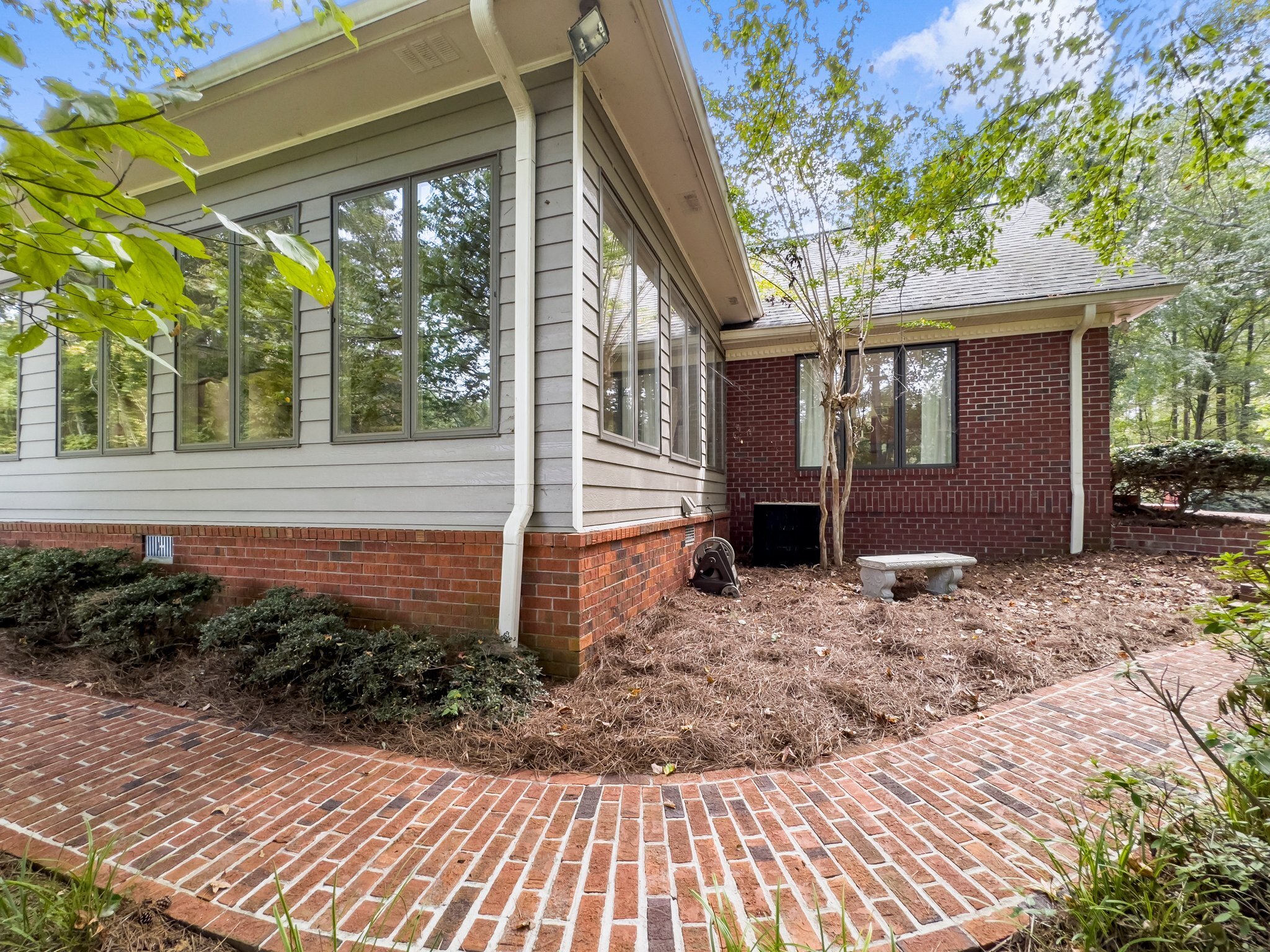 4394 Holly Springs Road Pendergrass, GA 30567 - Photo 63 of 80 a view of a house with a yard and pathway