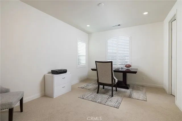 a view of a workspace with furniture