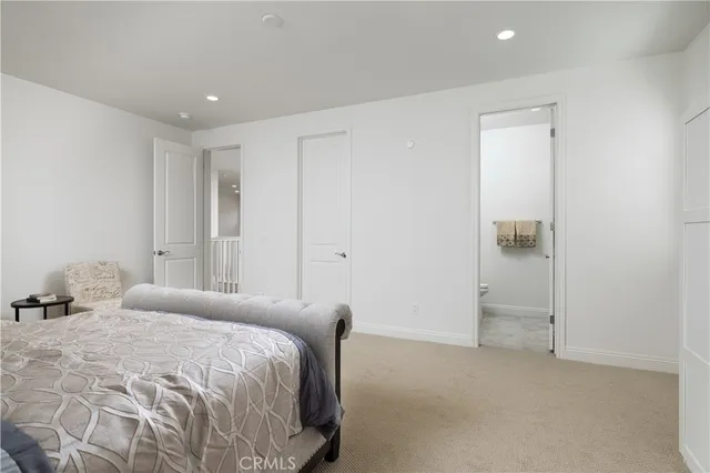 a bedroom with a bed and a closet
