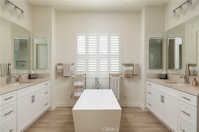 a large white kitchen with a large window