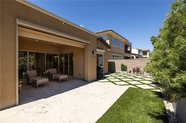 a view of balcony with a table and chairs