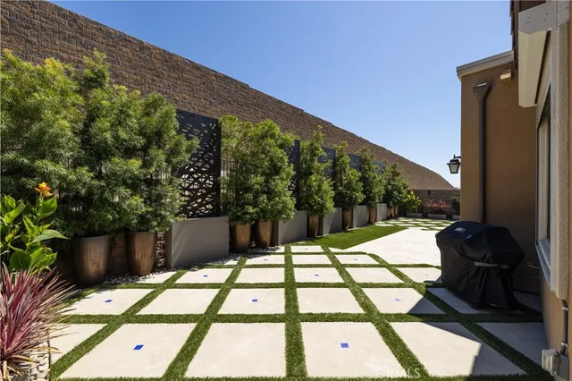 a front view of house with a garden